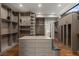 This expansive walk-in closet features an island and abundant custom storage at 505 Dragon Gate Ct, Henderson, NV 89012