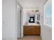 Bathroom with wooden cabinets and a large mirror at 5081 Pine Mountain Ave, Las Vegas, NV 89139