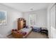 Bedroom featuring a single bed and two windows at 5081 Pine Mountain Ave, Las Vegas, NV 89139