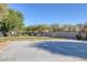Community park featuring a full basketball court, a green lawn and walking paths at 5081 Pine Mountain Ave, Las Vegas, NV 89139