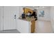 Efficient kitchen layout with stainless steel appliances, granite countertops, and white tile flooring at 5081 Pine Mountain Ave, Las Vegas, NV 89139
