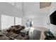 Spacious living room with vaulted ceiling, neutral color palette, and plenty of natural light at 5081 Pine Mountain Ave, Las Vegas, NV 89139