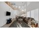 Bright living room with high ceilings, large windows, and modern staircase at 5081 Pine Mountain Ave, Las Vegas, NV 89139