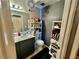 Cozy bathroom features a single sink vanity, toilet, and shelves for ample storage at 5225 W Reno Ave # 219, Las Vegas, NV 89118
