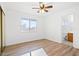Bedroom with a ceiling fan, closet, and a doorway leading to an ensuite bathroom at 5628 Crimson Ridge Dr, Las Vegas, NV 89130