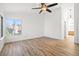 Spacious bedroom with a ceiling fan and a large window providing natural light at 5628 Crimson Ridge Dr, Las Vegas, NV 89130