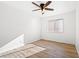 Clean bedroom with hardwood floors, ceiling fan, and natural light at 5628 Crimson Ridge Dr, Las Vegas, NV 89130