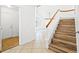 Entryway with hardwood stairs, tile flooring, and a view of the living room at 5628 Crimson Ridge Dr, Las Vegas, NV 89130