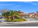 Beautiful single-Gathering home boasting a well-kept yard, green landscaping, and an attached spacious two-car garage at 5628 Crimson Ridge Dr, Las Vegas, NV 89130