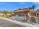 Attractive single-Gathering home with a well-manicured yard, long driveway, and a spacious attached two-car garage at 5628 Crimson Ridge Dr, Las Vegas, NV 89130