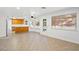 Open concept with oak cabinets in kitchen looking out over a large living area and backyard at 5628 Crimson Ridge Dr, Las Vegas, NV 89130