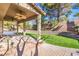 Covered patio with dual ceiling fans and views of the beautiful backyard landscaping at 5628 Crimson Ridge Dr, Las Vegas, NV 89130