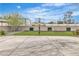 A concrete backyard featuring a basketball hoop, lush green lawn, and a tall block wall at 5700 N Torrey Pines Dr, Las Vegas, NV 89130
