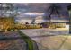 Extensive backyard featuring a basketball court, pergola, and manicured landscaping at 5700 N Torrey Pines Dr, Las Vegas, NV 89130