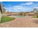 Beautiful backyard showcasing a swimming pool, pergola, and well-maintained lawn at 5700 N Torrey Pines Dr, Las Vegas, NV 89130