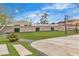 Lush, newly installed synthetic backyard lawn with decorative concrete accents and a tall block wall at 5700 N Torrey Pines Dr, Las Vegas, NV 89130