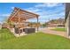 Inviting backyard with a pergola, outdoor seating, lush lawn, and a refreshing pool at 5700 N Torrey Pines Dr, Las Vegas, NV 89130