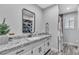 Bathroom featuring a granite countertop, modern fixtures, and decor at 5700 N Torrey Pines Dr, Las Vegas, NV 89130