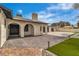 Charming home exterior with a brick driveway and a well-manicured front yard at 5700 N Torrey Pines Dr, Las Vegas, NV 89130