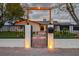 Inviting home exterior with brick walkway, well-lit entry, and wrought iron gate at 5700 N Torrey Pines Dr, Las Vegas, NV 89130