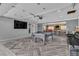 Entertaining game room with a pool table, large TV, and a comfortable seating area at 5700 N Torrey Pines Dr, Las Vegas, NV 89130