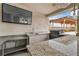 Outdoor kitchen with granite countertops, stainless steel grill, and overhead lighting at 5700 N Torrey Pines Dr, Las Vegas, NV 89130
