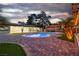 Stunning pool with brick-paved patio and well-maintained backyard, creating a relaxing outdoor oasis at 5700 N Torrey Pines Dr, Las Vegas, NV 89130