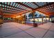Spacious outdoor area with a well-lit pergola, a sparkling pool, and comfortable seating at 5700 N Torrey Pines Dr, Las Vegas, NV 89130
