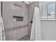 Modern tiled shower with a built-in niche, complemented by a window with natural light at 5700 N Torrey Pines Dr, Las Vegas, NV 89130