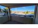 A balcony view showcases neighborhood rooftops and mountain views on a clear day at 5710 E Tropicana Ave # 2049, Las Vegas, NV 89122