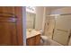 Clean bathroom featuring a vanity with storage and a walk-in shower at 5710 E Tropicana Ave # 2049, Las Vegas, NV 89122