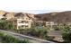 Aerial view of homes nestled in a desert landscape with vibrant landscaping at 6 Kaya Canyon Way # 14, Henderson, NV 89012