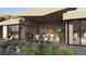 This home features a beautiful backyard with a stone facade, an outdoor kitchen, and bedrooms with exterior access at 6 Kaya Canyon Way # 14, Henderson, NV 89012