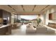 Open concept living room features a fireplace, wine storage and bar, with mountain views at 6 Kaya Canyon Way # 14, Henderson, NV 89012