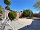 Backyard with patio area, landscaping, and brick wall, creating a serene outdoor retreat at 6620 Casa Linda Dr, Las Vegas, NV 89103