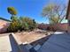 Backyard showcasing landscaping, including trees and concrete patio, perfect for outdoor enjoyment at 6620 Casa Linda Dr, Las Vegas, NV 89103