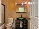 Bright bathroom featuring decorative tile work, black vanity with glass bowl sink, and a shower with glass door at 6620 Casa Linda Dr, Las Vegas, NV 89103