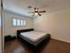 Bedroom featuring modern black platform bed with hardwood floors, and ceiling fan at 6620 Casa Linda Dr, Las Vegas, NV 89103