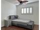 Bedroom featuring modern gray bed, sliding closet doors, and shuttered window at 6620 Casa Linda Dr, Las Vegas, NV 89103
