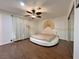 Bright bedroom featuring hardwood floors, a ceiling fan, and a unique round platform bed with art piece at 6620 Casa Linda Dr, Las Vegas, NV 89103