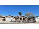 Inviting single-story home featuring a decorative front fence and mature desert landscaping at 6620 Casa Linda Dr, Las Vegas, NV 89103