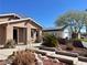 A well maintained front yard with lush desert landscaping and stone steps leading to the entrance at 6620 Casa Linda Dr, Las Vegas, NV 89103