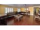 A large living room featuring elegant furniture and wood-look floors at 6620 Casa Linda Dr, Las Vegas, NV 89103