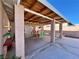Covered patio area with outdoor dining set, providing a comfortable space for entertaining guests at 6620 Casa Linda Dr, Las Vegas, NV 89103