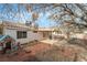 Expansive backyard with covered patio, playhouse and slide, offering ample space for outdoor activities at 715 Rusty Spur Dr, Henderson, NV 89014