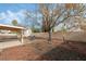 View of the spacious backyard with covered patio and play area, ideal for Gathering gatherings at 715 Rusty Spur Dr, Henderson, NV 89014