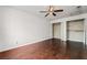 Bedroom with hardwood floors, a ceiling fan, and ample closet space at 715 Rusty Spur Dr, Henderson, NV 89014