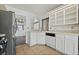 Well-lit kitchen featuring modern appliances, tiled floors and bright cabinetry at 715 Rusty Spur Dr, Henderson, NV 89014