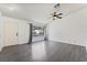 Spacious living room with hardwood floors, a large window, and a ceiling fan at 715 Rusty Spur Dr, Henderson, NV 89014