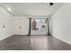 View of a living room featuring hardwood floors, a large window, and neutral walls at 715 Rusty Spur Dr, Henderson, NV 89014
